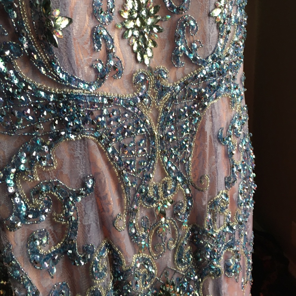 Never worn. Like new. Couture.
